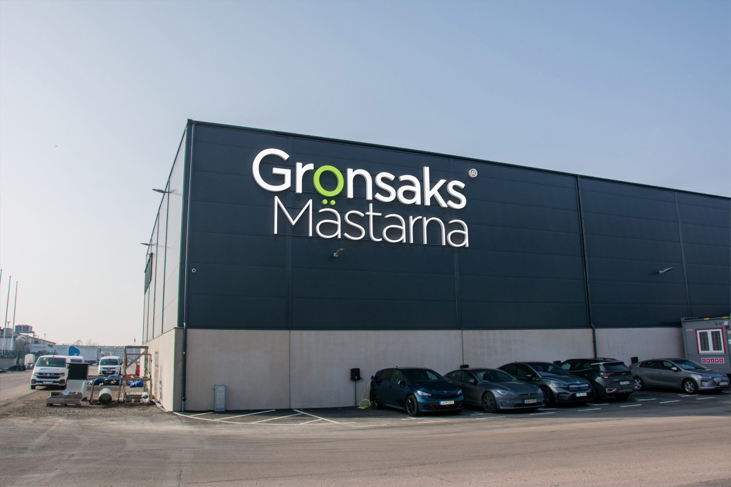3D-visualisering av Grönsaksmästarnas fasadskylt i dagsljus